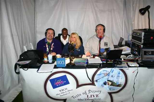 Four presenters in headphones at a remote broadcast desk under a banner reading WRCH — Allan, Mike & Allison, Hartford CT — Taste of Disney LIVE, Walt Disney World